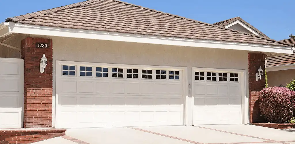 Residential garage door repair service for a double garage door in Albany, NY