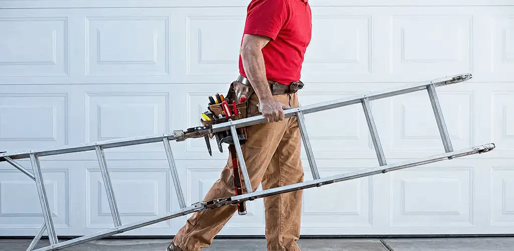 Garage door repair technician arriving with tools and ladder in Albany, NY